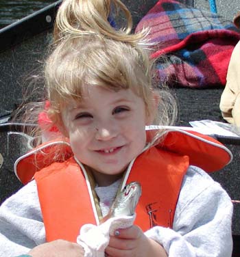 Emily and her first trout!