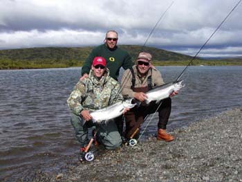 Father and Son Double up on a pair of Togiak River Silvers. Togiak River Lodge, Bristol Bay, Alaska